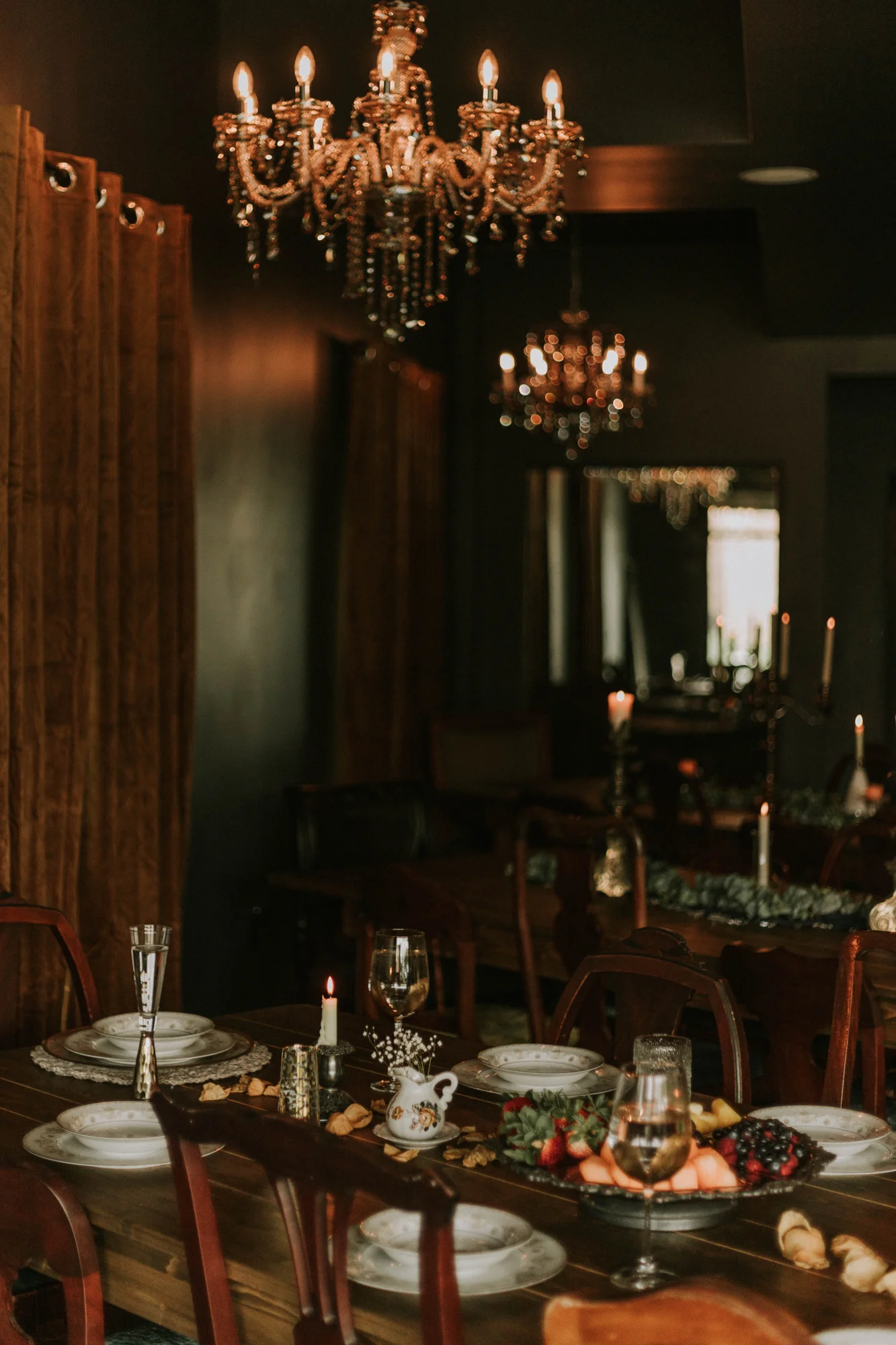 Intimate tables beneath brass chandeliers